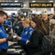 Passengers experience long lines at airport security due to the DHS travel disruption